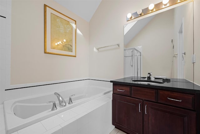 full bath featuring walk in shower, vaulted ceiling, a bath, and vanity