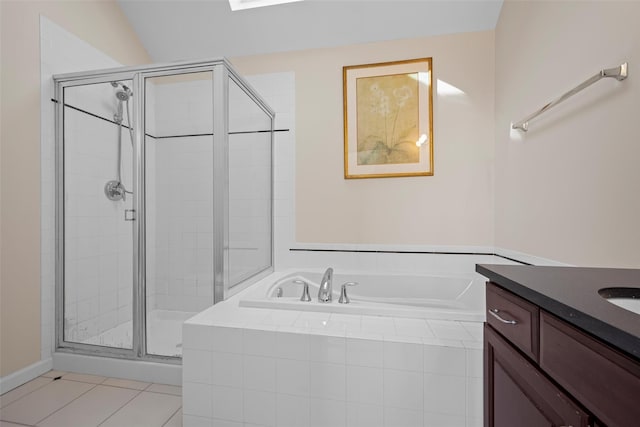 full bathroom featuring a stall shower, tile patterned floors, vanity, and a bath