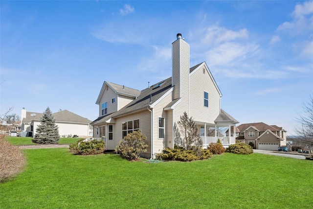 exterior space with a chimney and a lawn