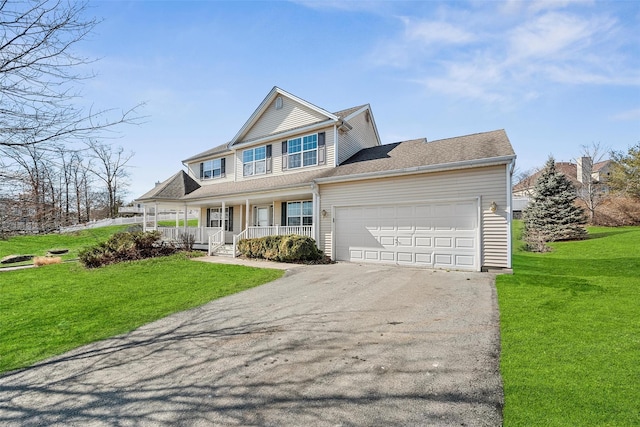 view of front of house featuring covered porch, driveway, a front lawn, and an attached garage