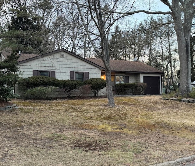 ranch-style home featuring an attached garage