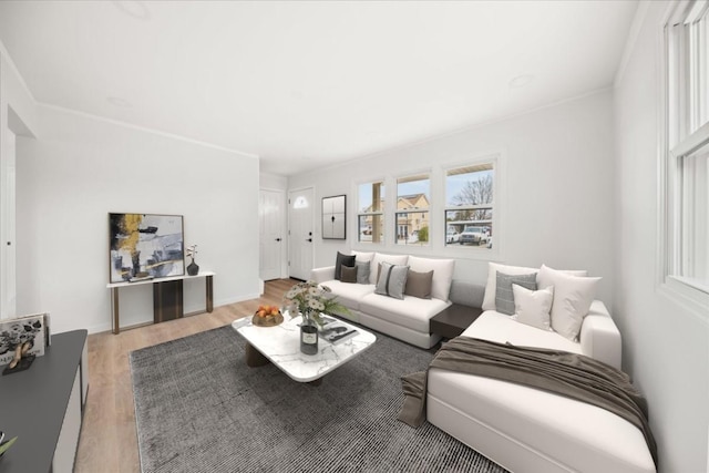 living area featuring light wood-style flooring and baseboards