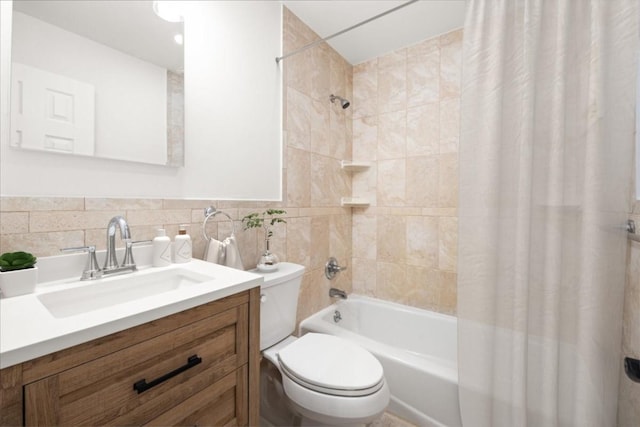 full bath with toilet, a wainscoted wall, tile walls, vanity, and shower / bathtub combination with curtain