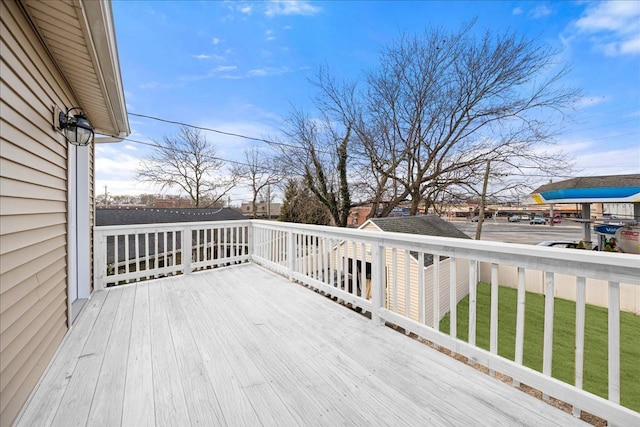 wooden terrace with a yard