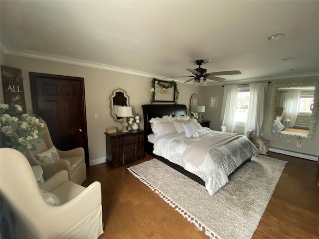 bedroom with ornamental molding, baseboard heating, a ceiling fan, and wood finished floors