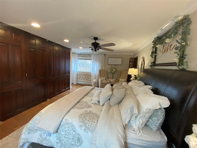 bedroom featuring crown molding, light wood-style floors, recessed lighting, a baseboard heating unit, and a ceiling fan