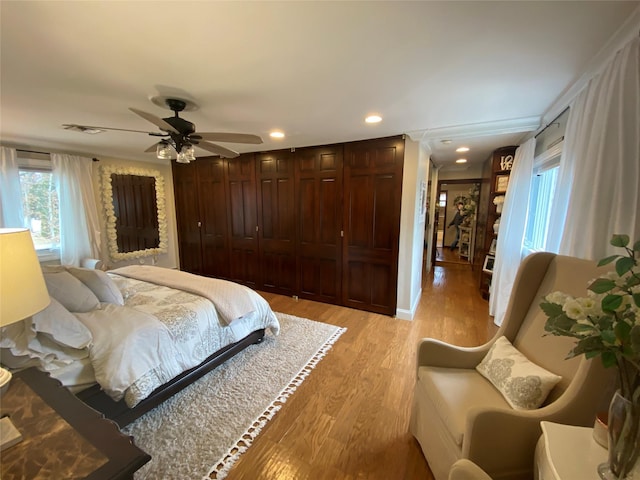 bedroom featuring recessed lighting, ceiling fan, visible vents, and light wood finished floors