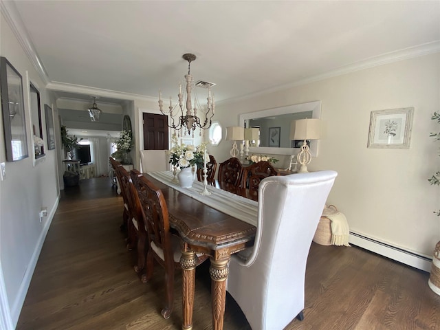 dining space with crown molding, visible vents, baseboard heating, and wood finished floors