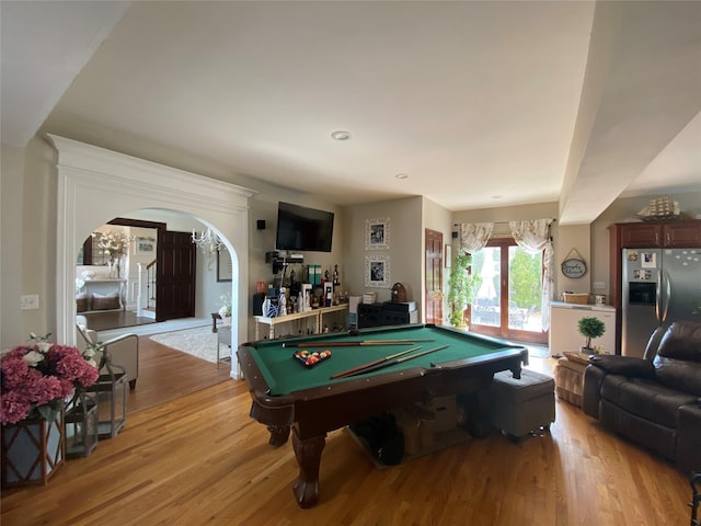 playroom featuring arched walkways, recessed lighting, billiards, and light wood-type flooring
