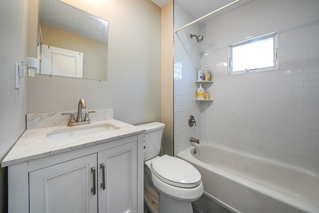 bathroom featuring toilet,  shower combination, and vanity