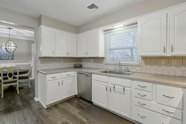 kitchen featuring dark wood finished floors, visible vents, stainless steel dishwasher, white cabinetry, and a sink