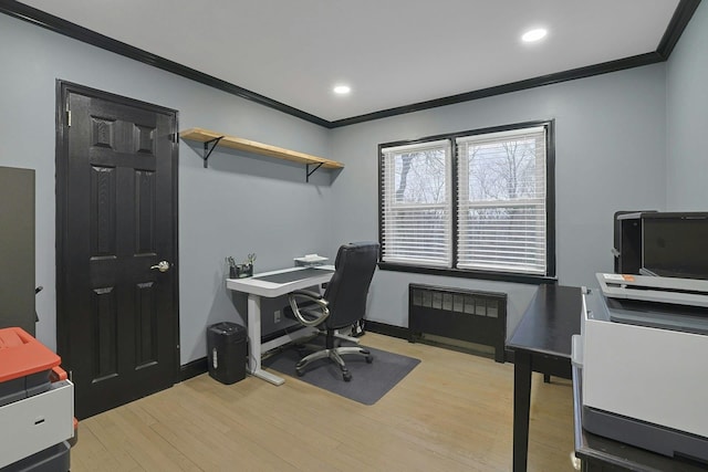 office space with recessed lighting, wood finished floors, baseboards, ornamental molding, and radiator heating unit