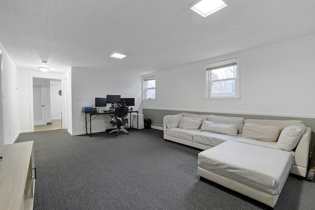 home office featuring dark carpet and baseboards