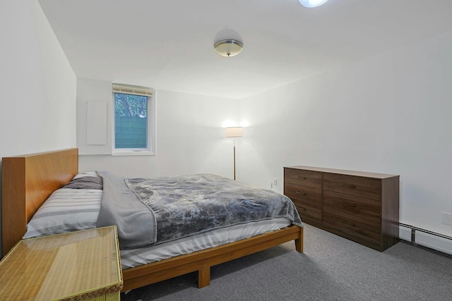 carpeted bedroom featuring a baseboard heating unit