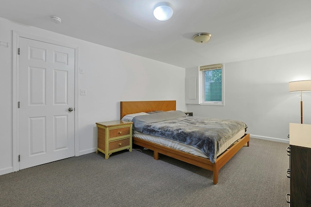 bedroom featuring carpet and baseboards