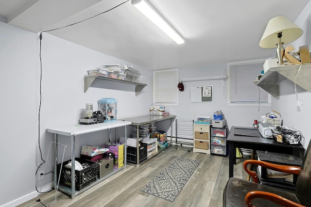 office with light wood-type flooring