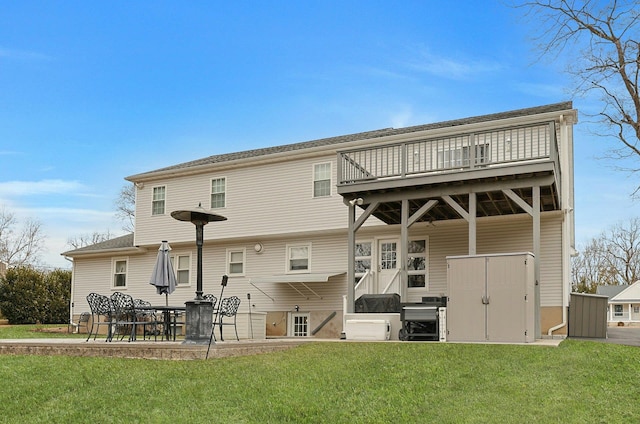 back of property featuring a yard and a patio area