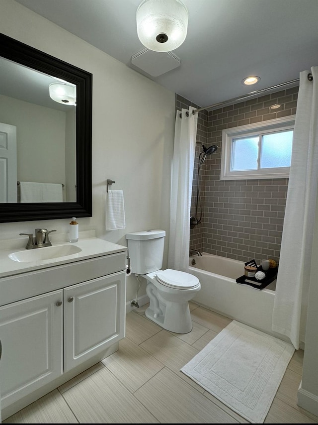 bathroom featuring toilet, shower / bath combo, and vanity