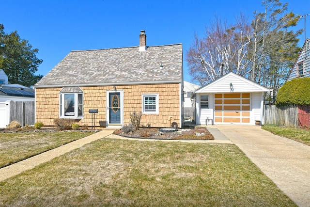 view of front of property with driveway, a front yard, and fence