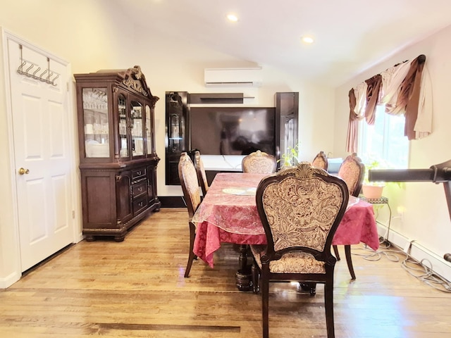 dining room with lofted ceiling, light wood-type flooring, recessed lighting, and a wall mounted AC