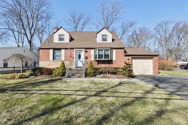 cape cod-style house featuring a front lawn, a garage, brick siding, and driveway