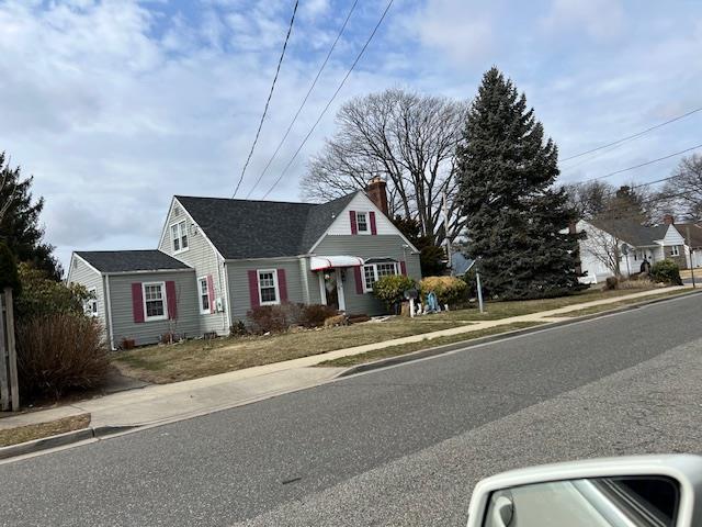 view of front of property featuring a chimney