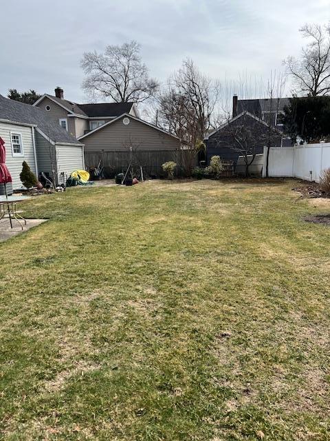 view of yard with a fenced backyard and a patio