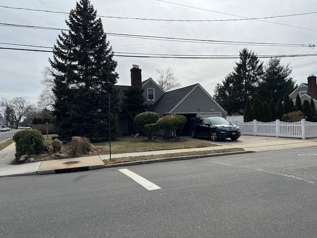 view of front of property featuring fence