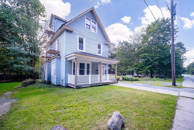 view of front of home featuring a porch and a front yard