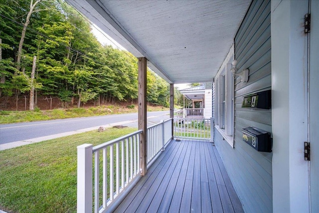 wooden terrace with a porch