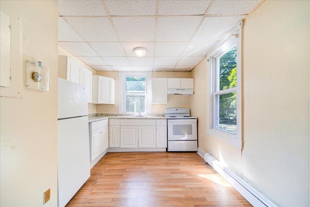 kitchen featuring white appliances, a drop ceiling, a baseboard radiator, under cabinet range hood, and white cabinetry