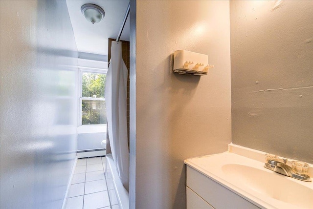 bathroom featuring a baseboard radiator, tile patterned flooring, and vanity