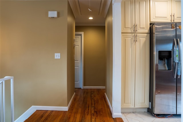 hallway with attic access, baseboards, ornamental molding, and recessed lighting