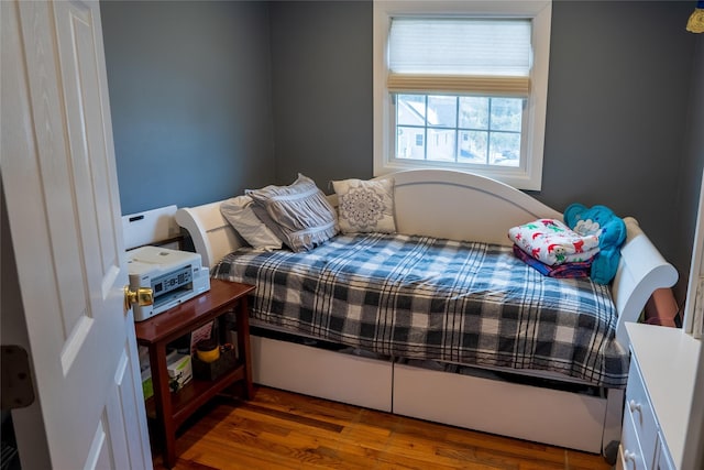 bedroom with wood finished floors