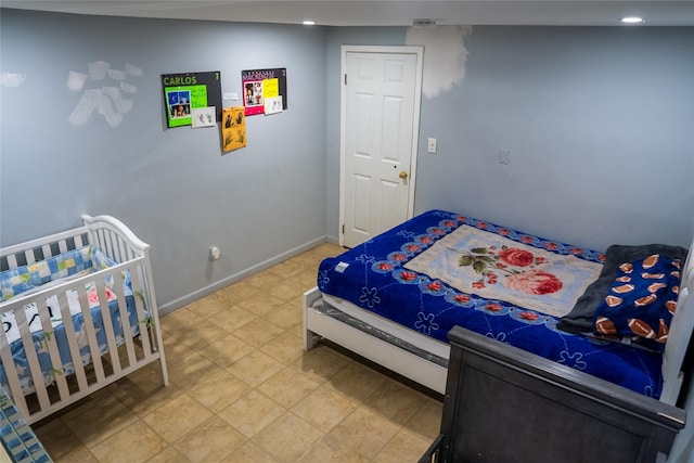 bedroom featuring baseboards and recessed lighting