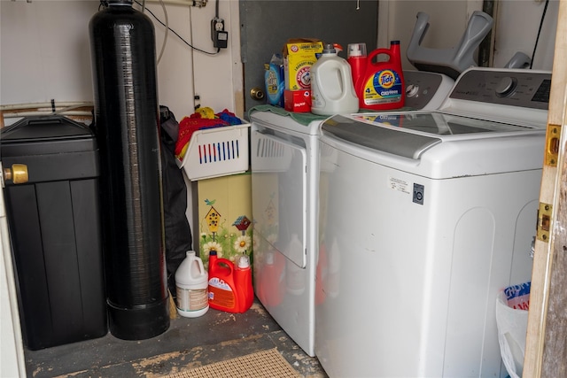 clothes washing area featuring laundry area and washing machine and clothes dryer