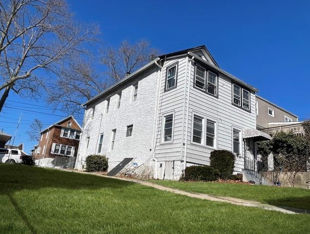 view of home's exterior featuring a yard