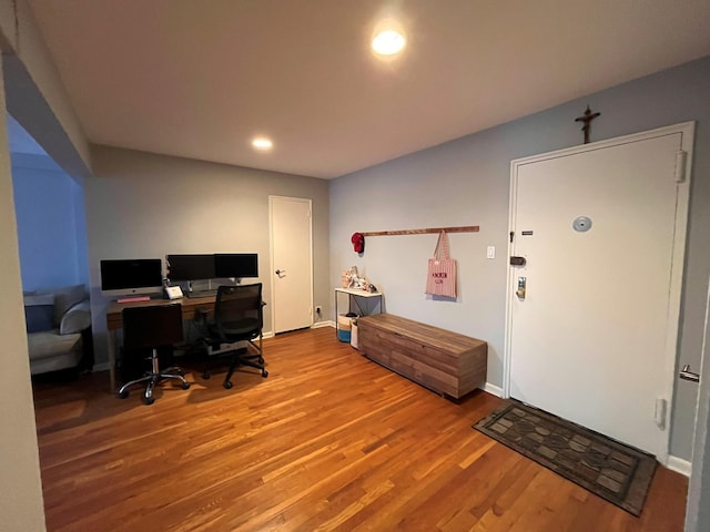 office space with recessed lighting, baseboards, and wood finished floors