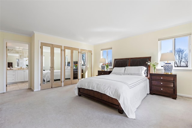 carpeted bedroom featuring french doors, multiple windows, two closets, and crown molding