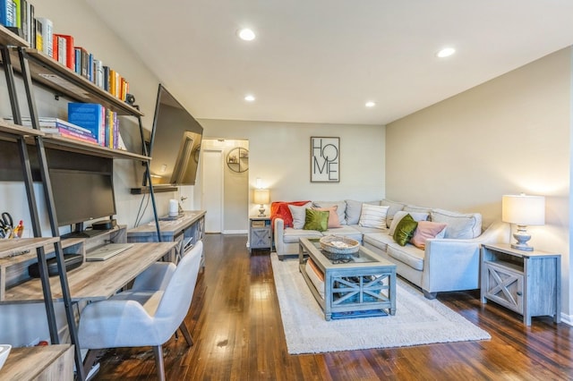 living area with wood finished floors and recessed lighting