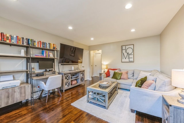 living area with wood finished floors and recessed lighting