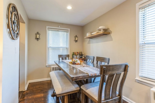 dining space with baseboards, dark wood-style flooring, and recessed lighting