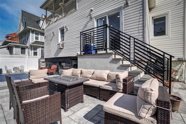 view of patio / terrace featuring an outdoor hangout area, cooling unit, and fence