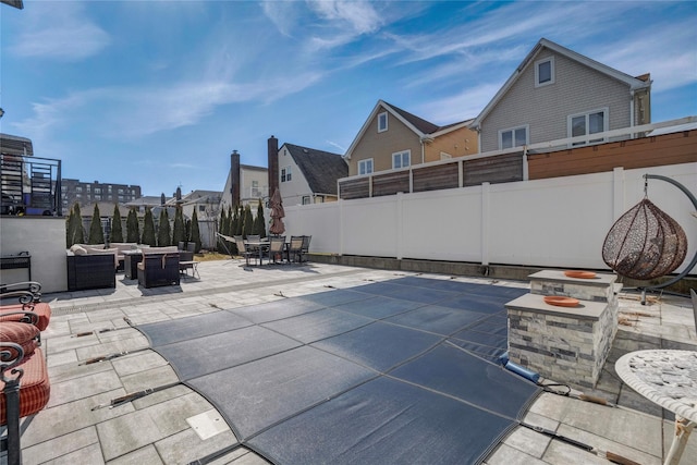 view of pool with an outdoor hangout area, outdoor dining area, a patio area, and a fenced backyard