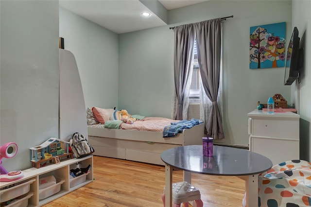 bedroom featuring light wood-style floors and recessed lighting