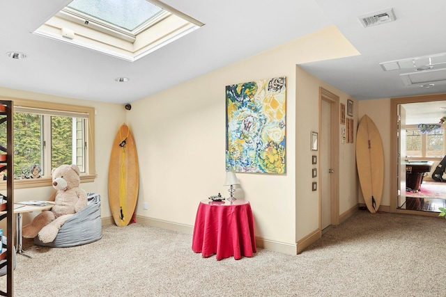 recreation room featuring carpet floors, visible vents, and baseboards