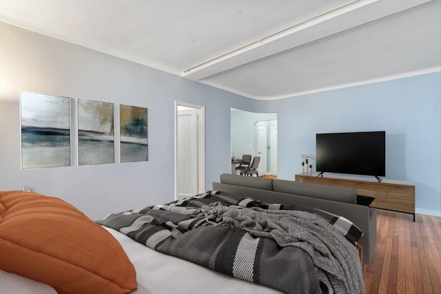 bedroom with wood-type flooring