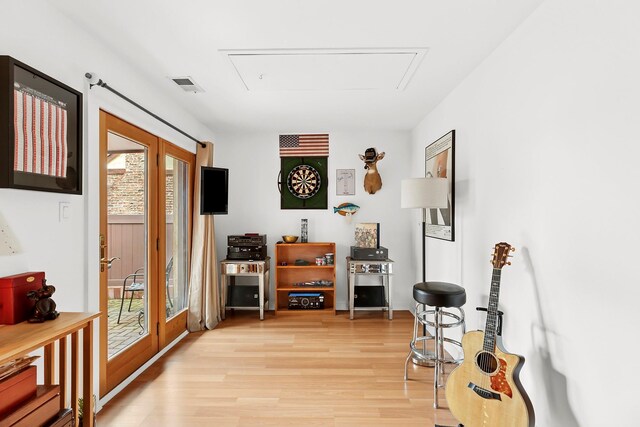 interior space featuring french doors, visible vents, and light wood finished floors