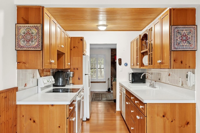 kitchen featuring wooden ceiling, white appliances, light wood finished floors, and a sink