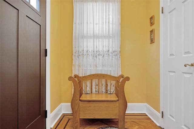 living area featuring baseboards